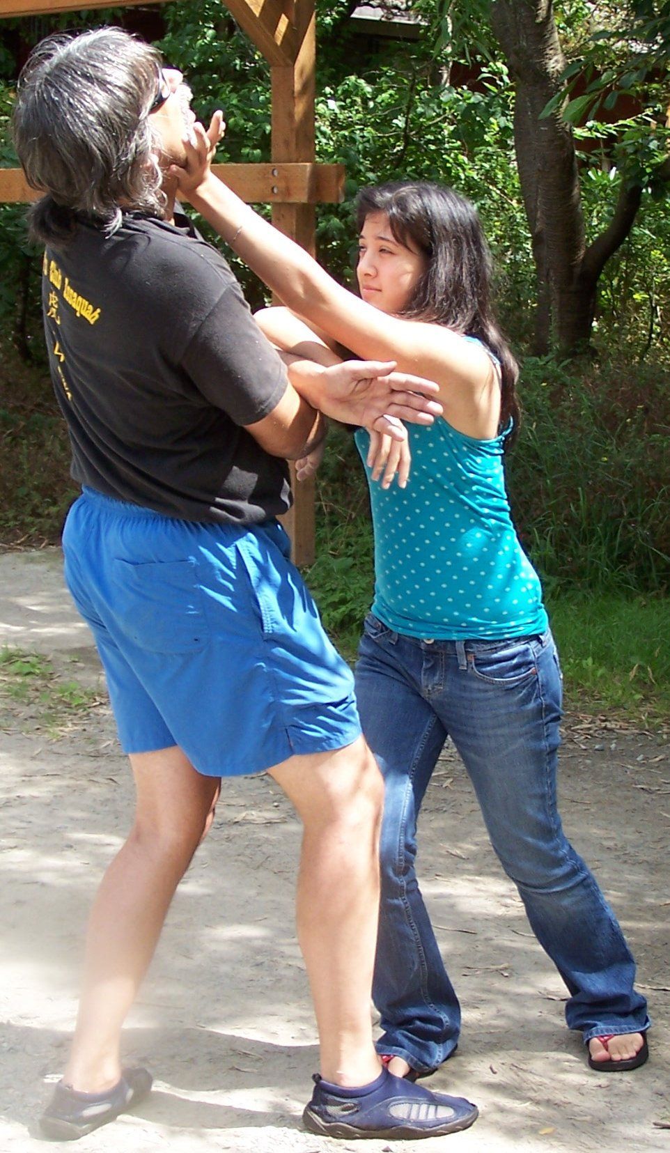 Two students practicing Wing Chun outdoors in the woods